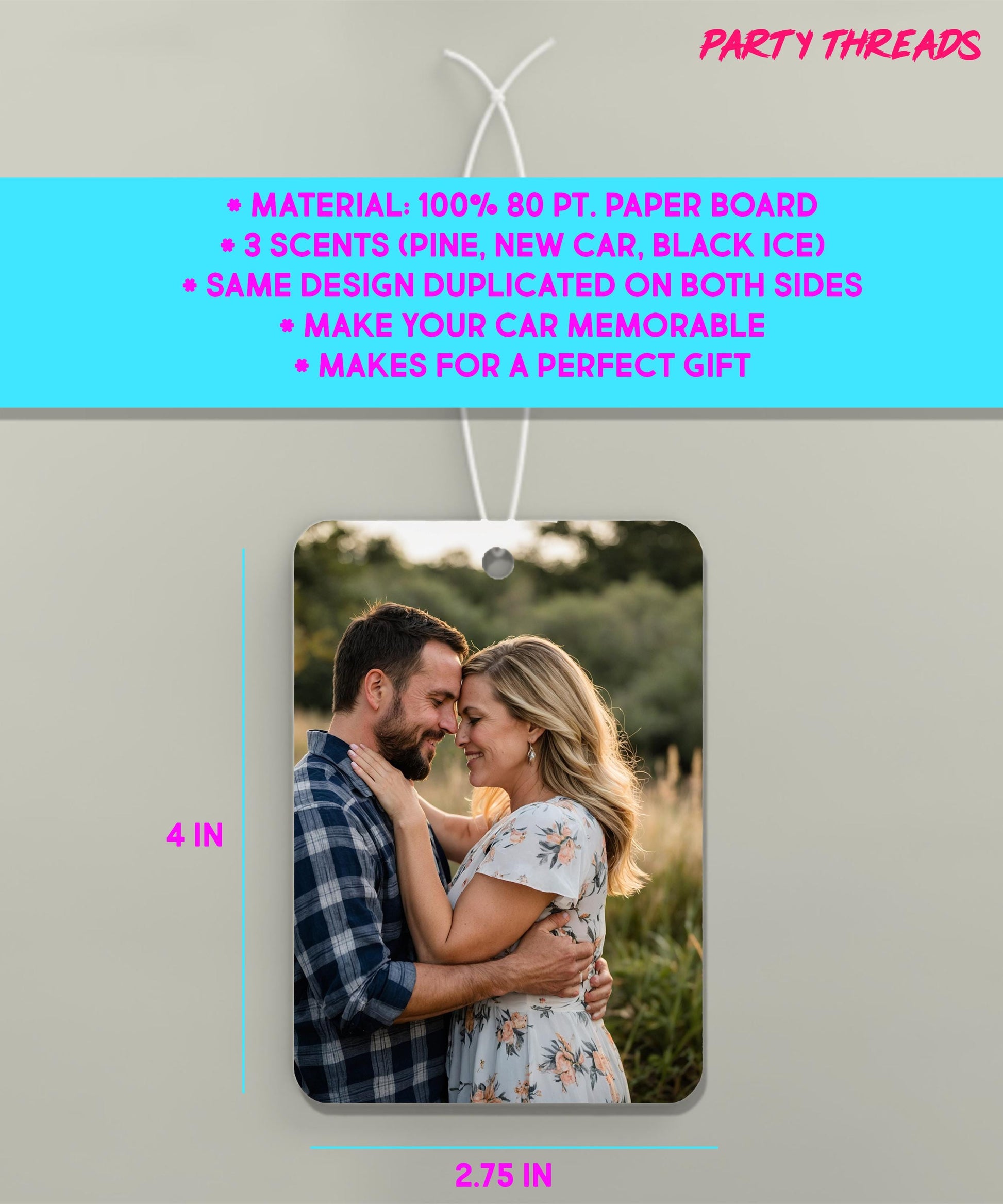 a picture of a couple hanging from a string